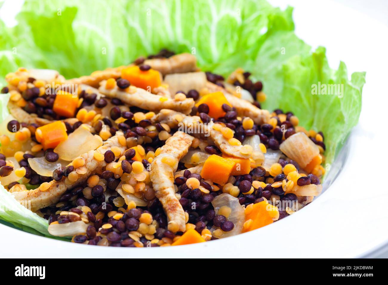 lentil salad with poultry meat and vegetables. Stock Photo