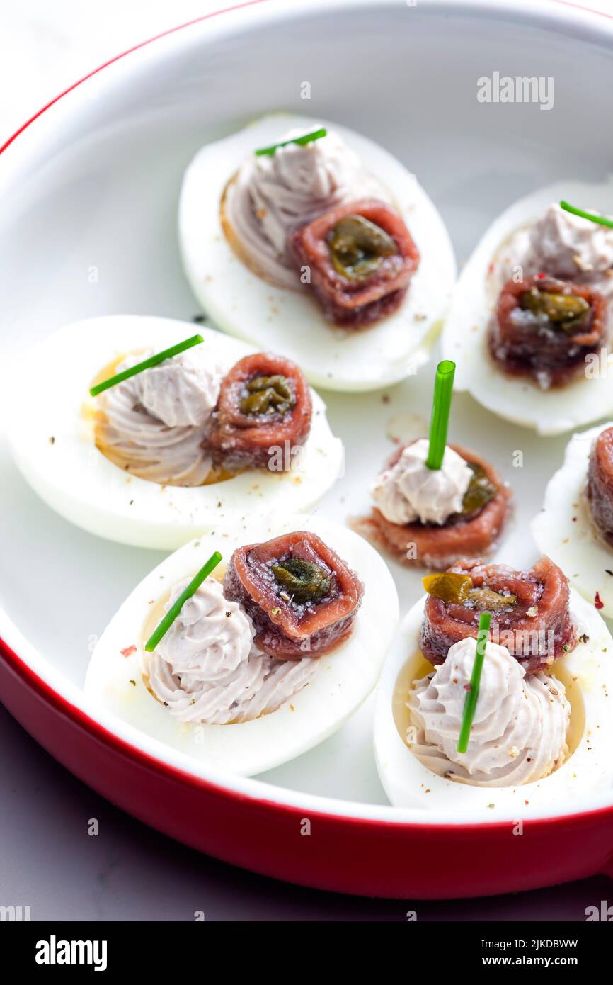 eggs filled with anchoa spread with anchoa on the top. Stock Photo