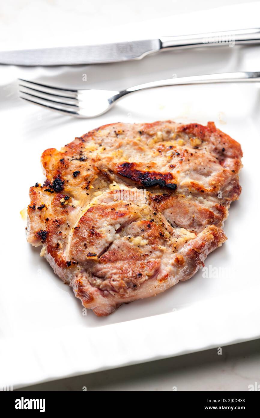 pork cutlet on white plate. Stock Photo
