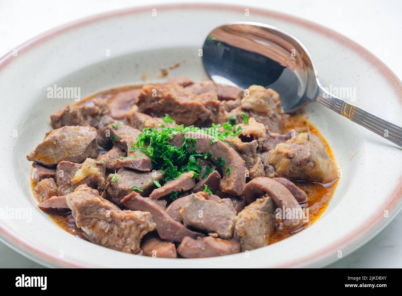 stew of meat, livers and kidneys. Stock Photo
