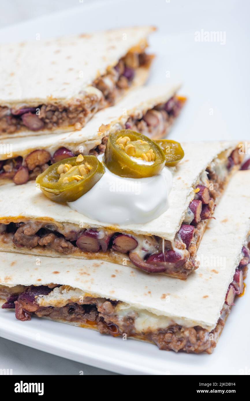 quesadilla filled with minced beef meat, beans and cheese Stock Photo