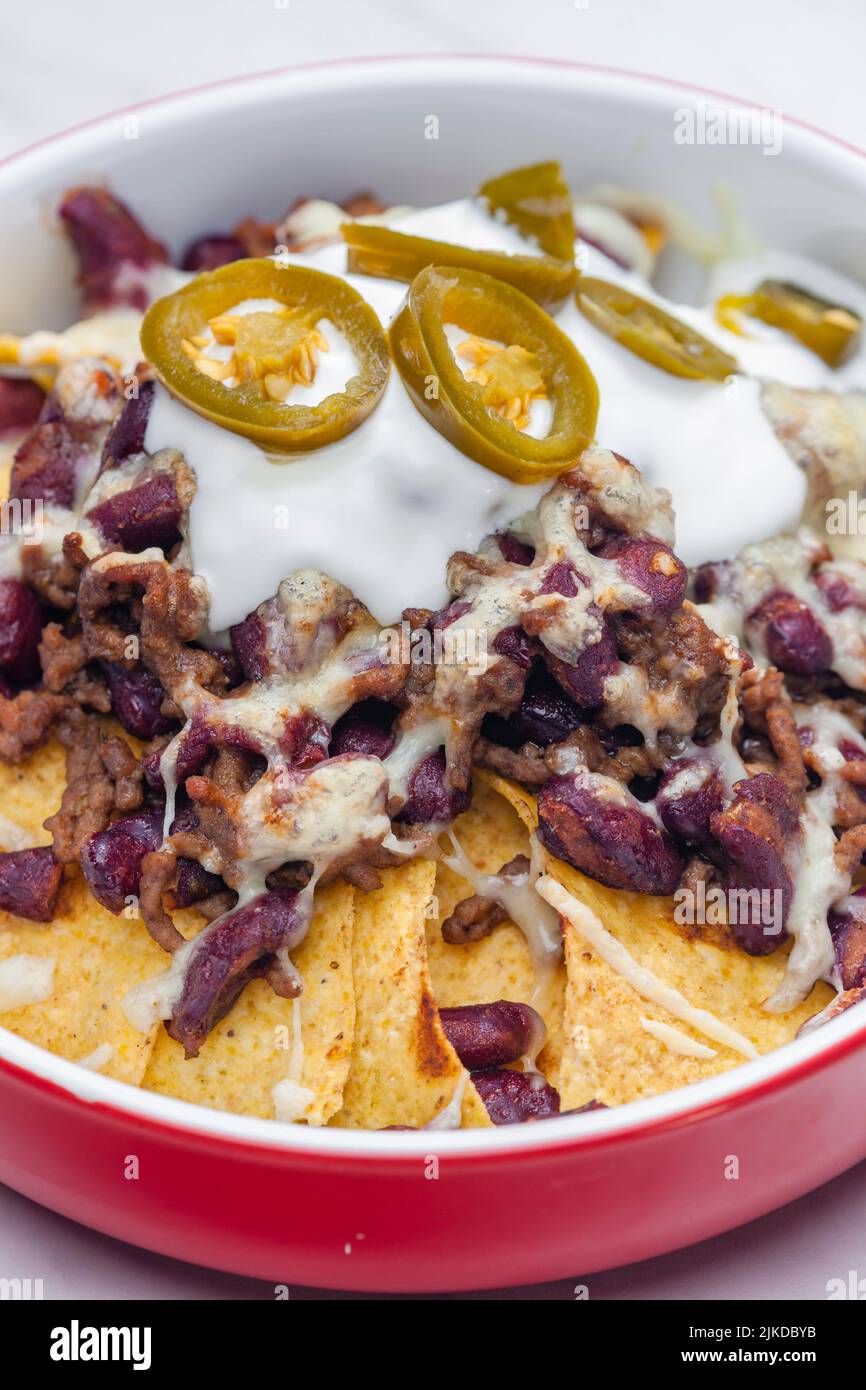 nachos baked with mince beef meat, cheese and red beans. Stock Photo
