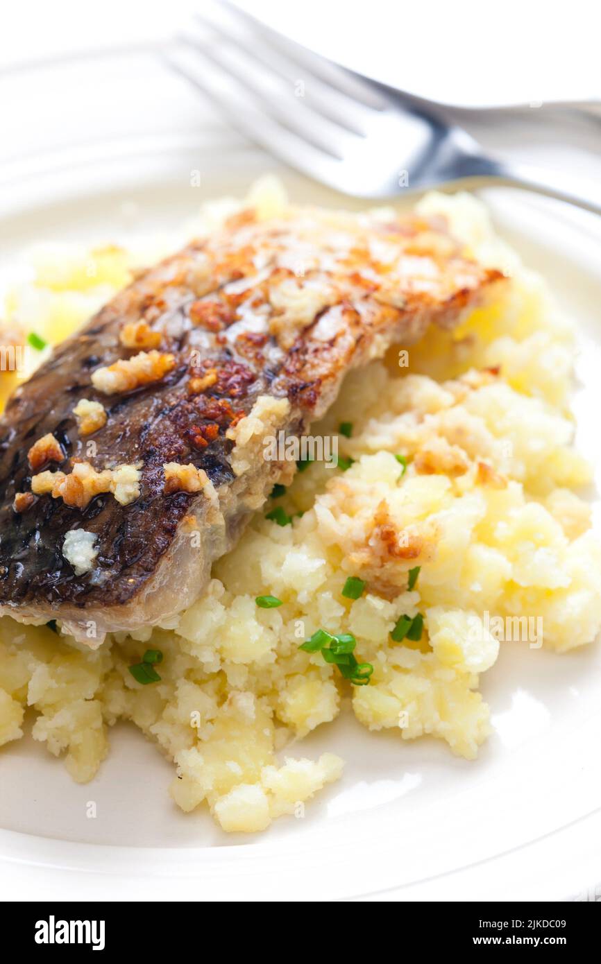 grilled carp with garlic served with mashed potatoes. Stock Photo