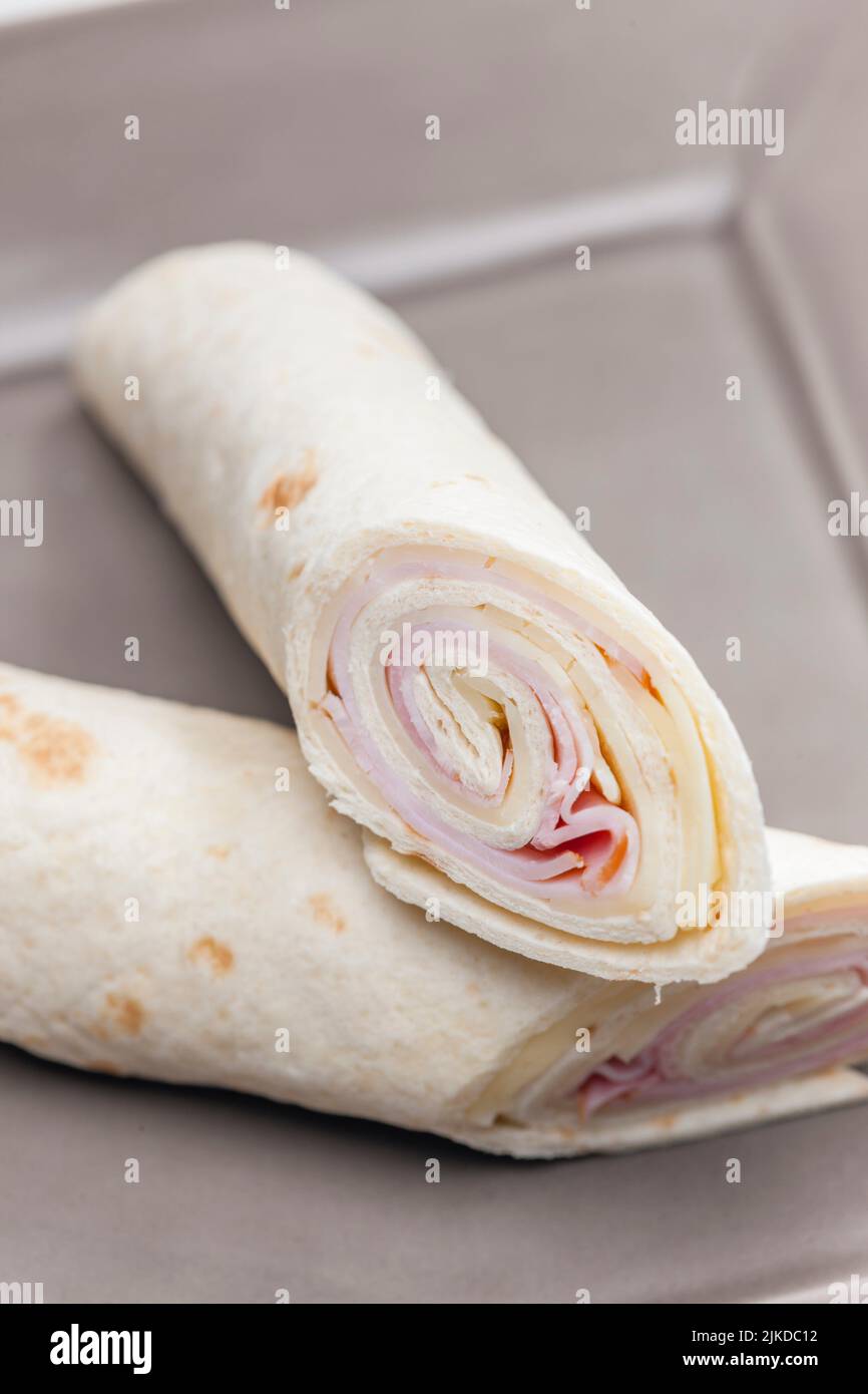 wrap filled with ham and cheese. Stock Photo