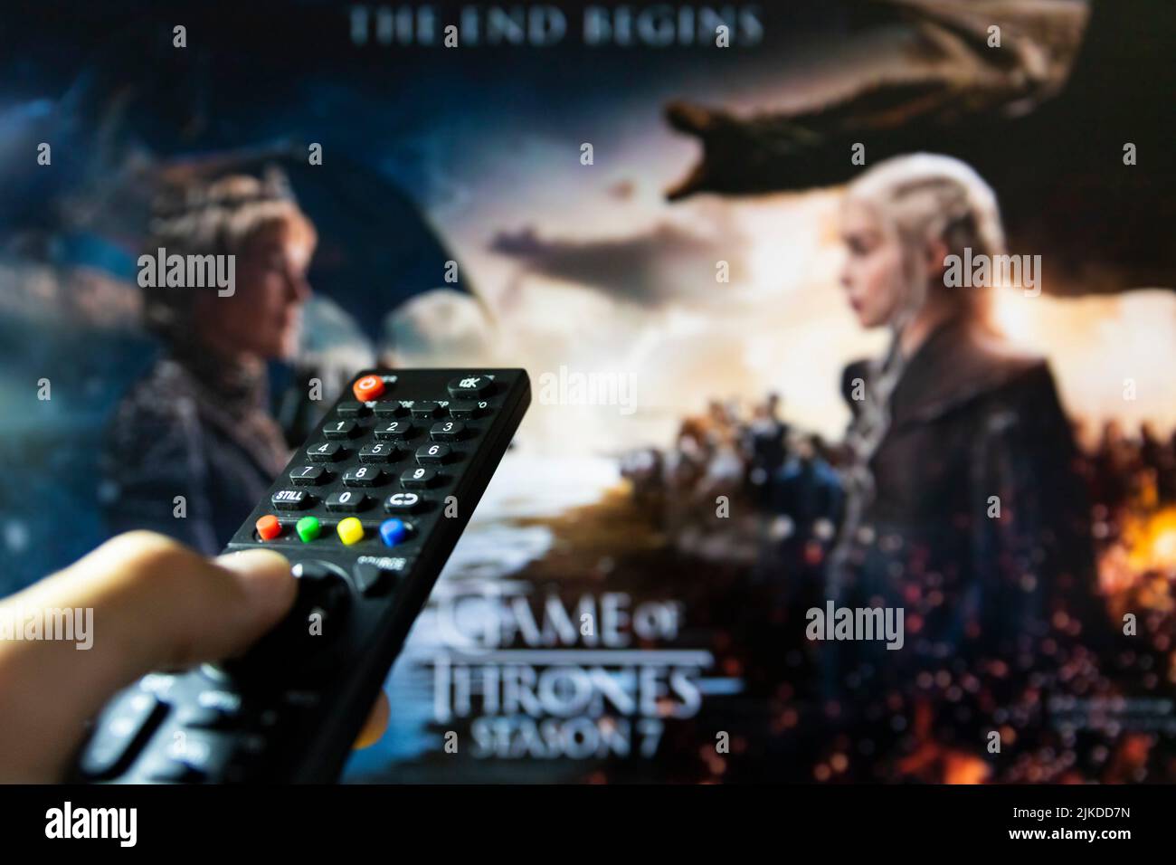 Belgrade, Serbia - July 22, 2022: Game of Thrones HBO TV series on TV with remote control in hand. Focuse on the remote. Nine noble families fight Stock Photo