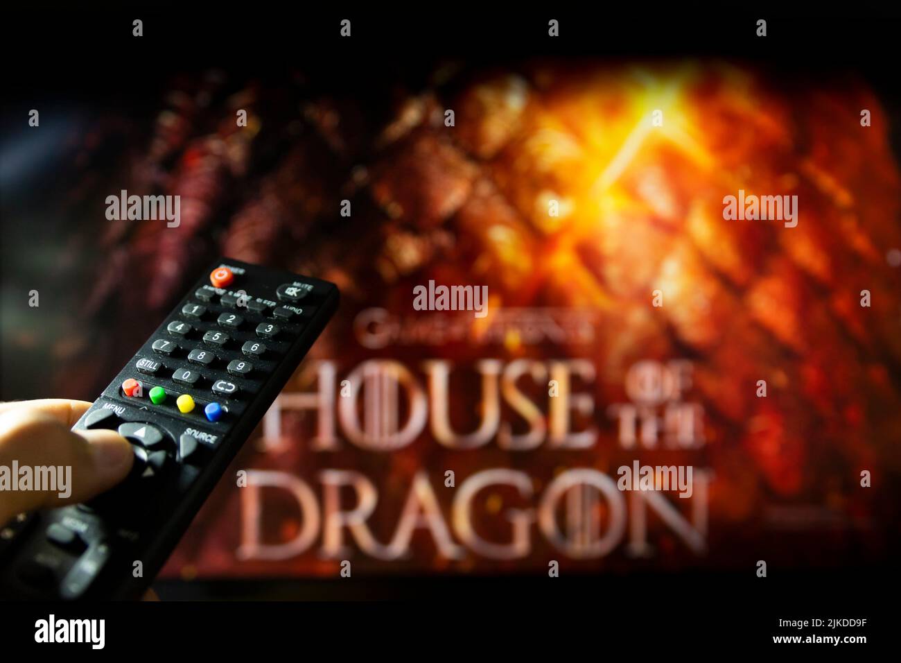 Belgrade, Serbia - July 22, 2022: House of the Dragon HBO TV series on TV with remote control in hand. Focuse on the remote. Story takes place 300 Stock Photo