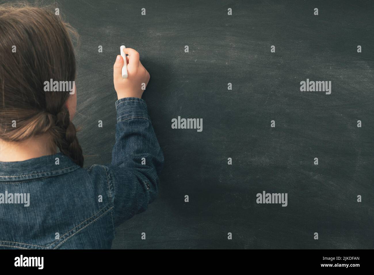 school education girl writing blank chalkboard Stock Photo