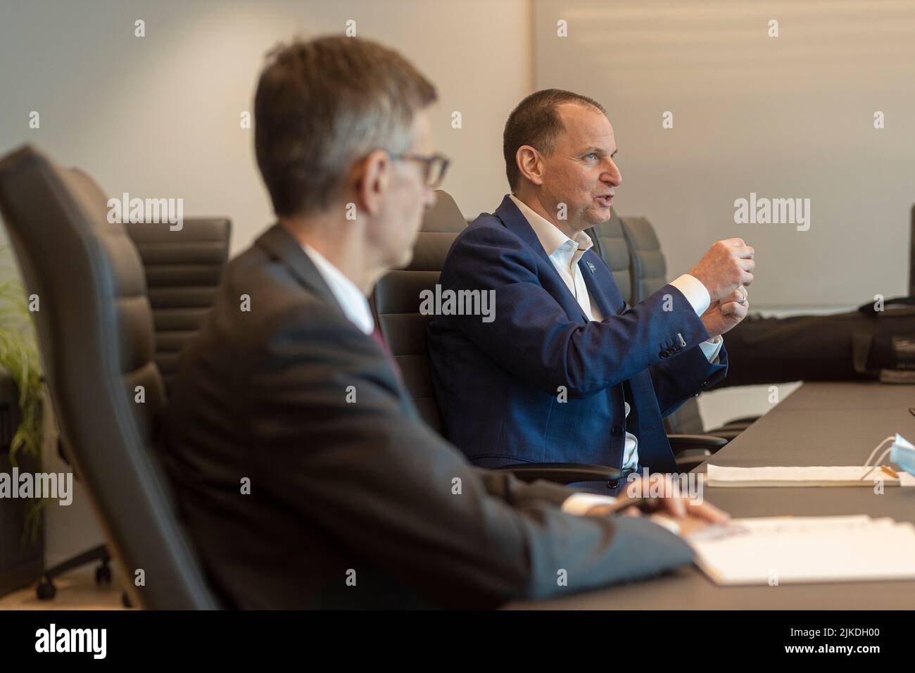 Quebec finance Minister Eric Girard (right) and his deputy minister Pierre Cote answer questions at his Quebec City office Thursday March 17, 2022. Stock Photo