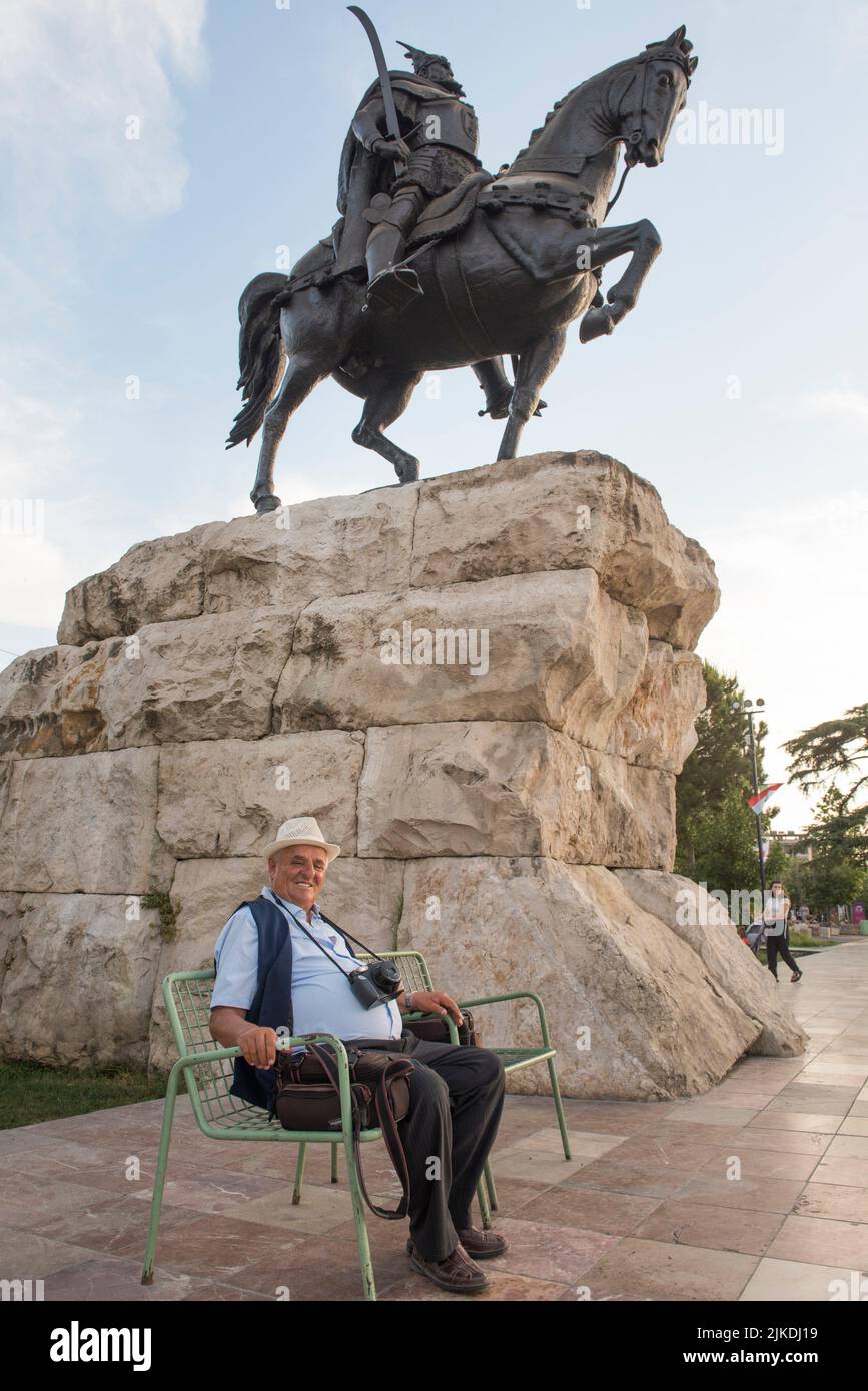 Public photographer posing under the Equestrian statue of Georges Kastrioti (1405-1468) known as ''Skanderbeg'' (i. e. , ''Prince Alexander,'' in Stock Photo
