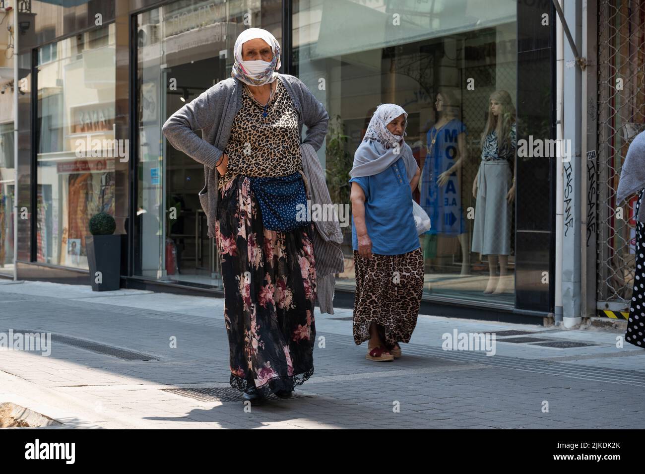ATHENS, GREECE MAY 14, 2022 Women in headscarves and masks in the