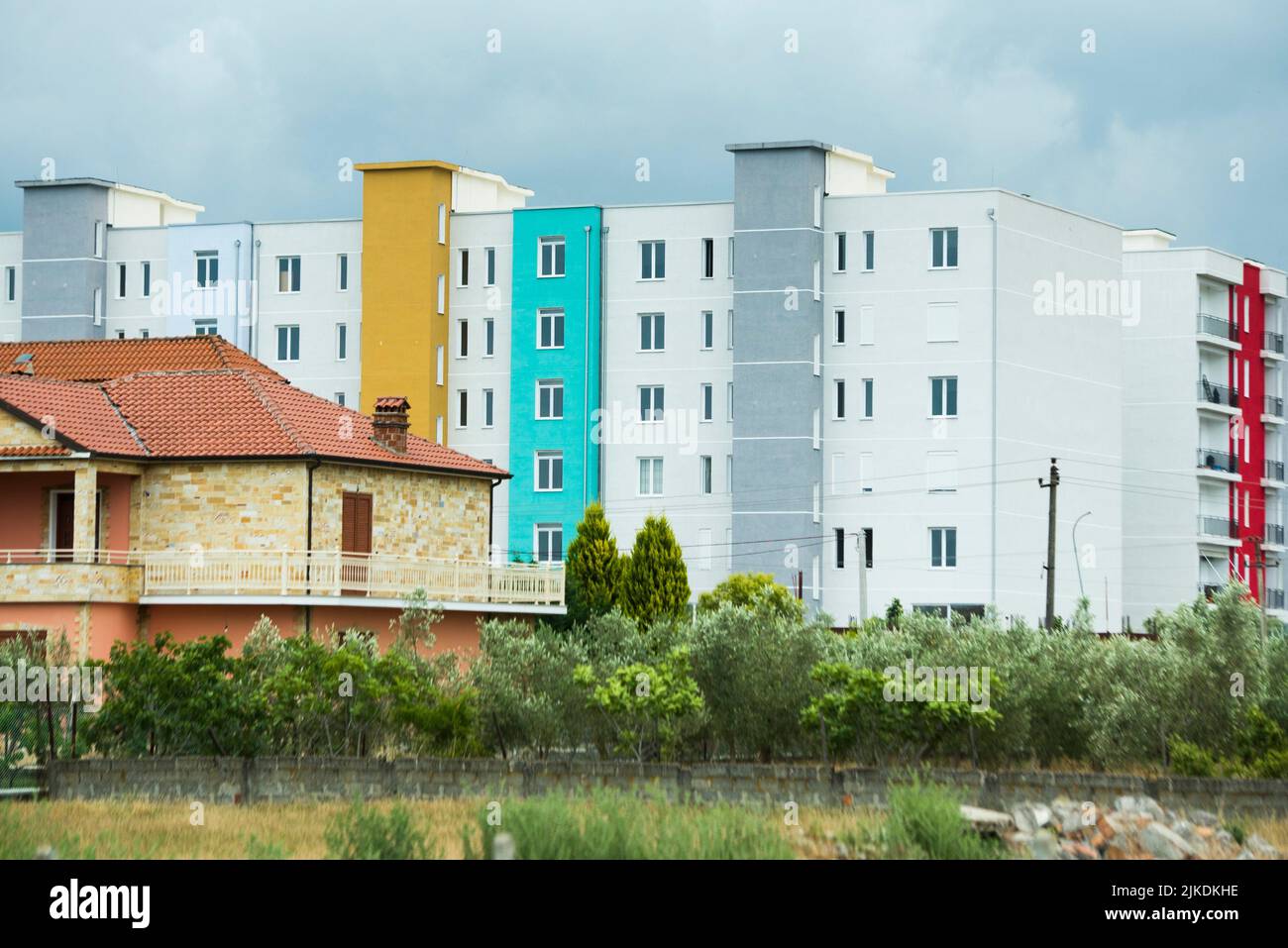 Modern building and traditional house in the suburbs of Tirana, Albania, Southeastern Europe