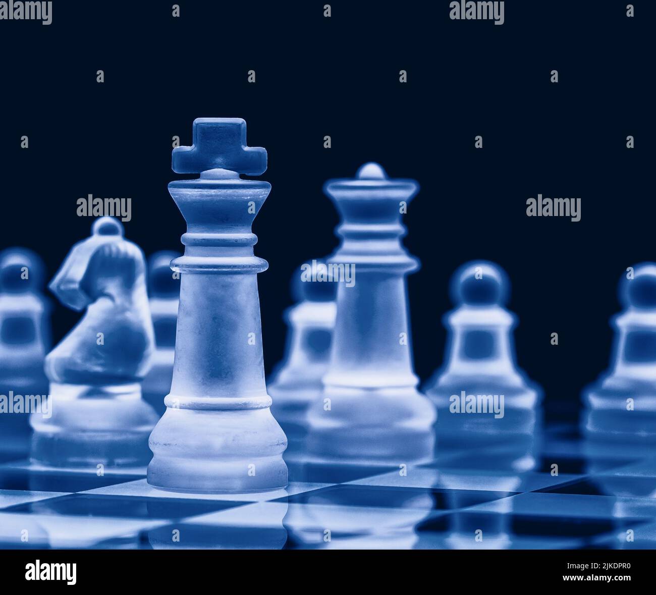 Glass chess on chess board. Close up with the black background Stock Photo  - Alamy