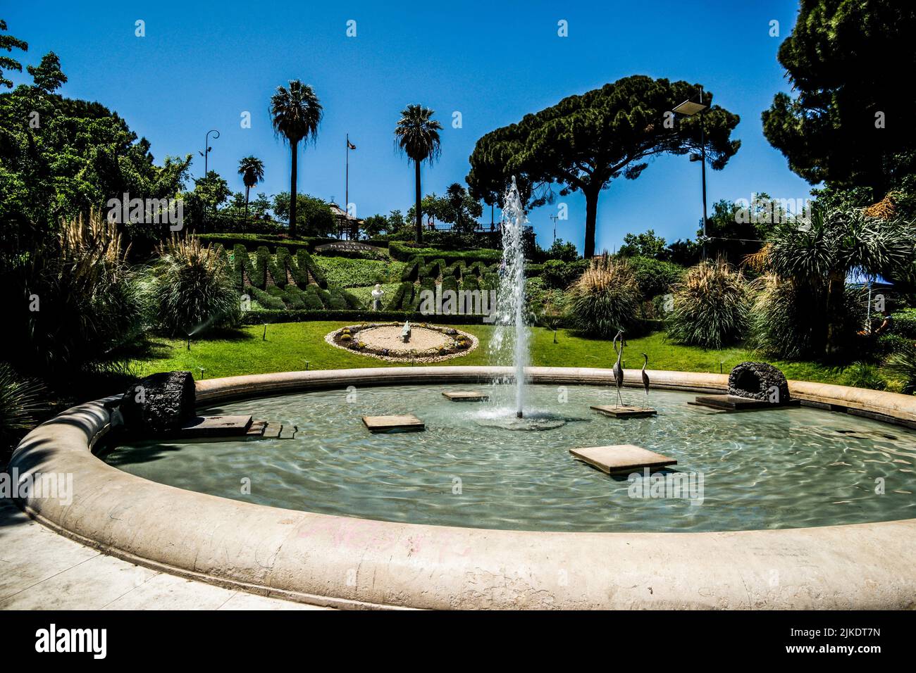 Bellini Park (Villa Bellini) with its floral clock and fountain. Park is dedicated to opera composer Vincenzo Bellini born in Catania. Via Etnea, Stock Photo