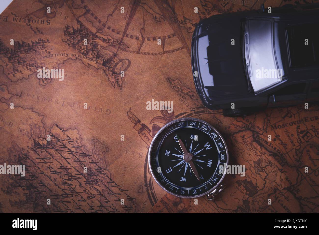 Tourist travel by car. Travel by car. Compass and car. Autotourism