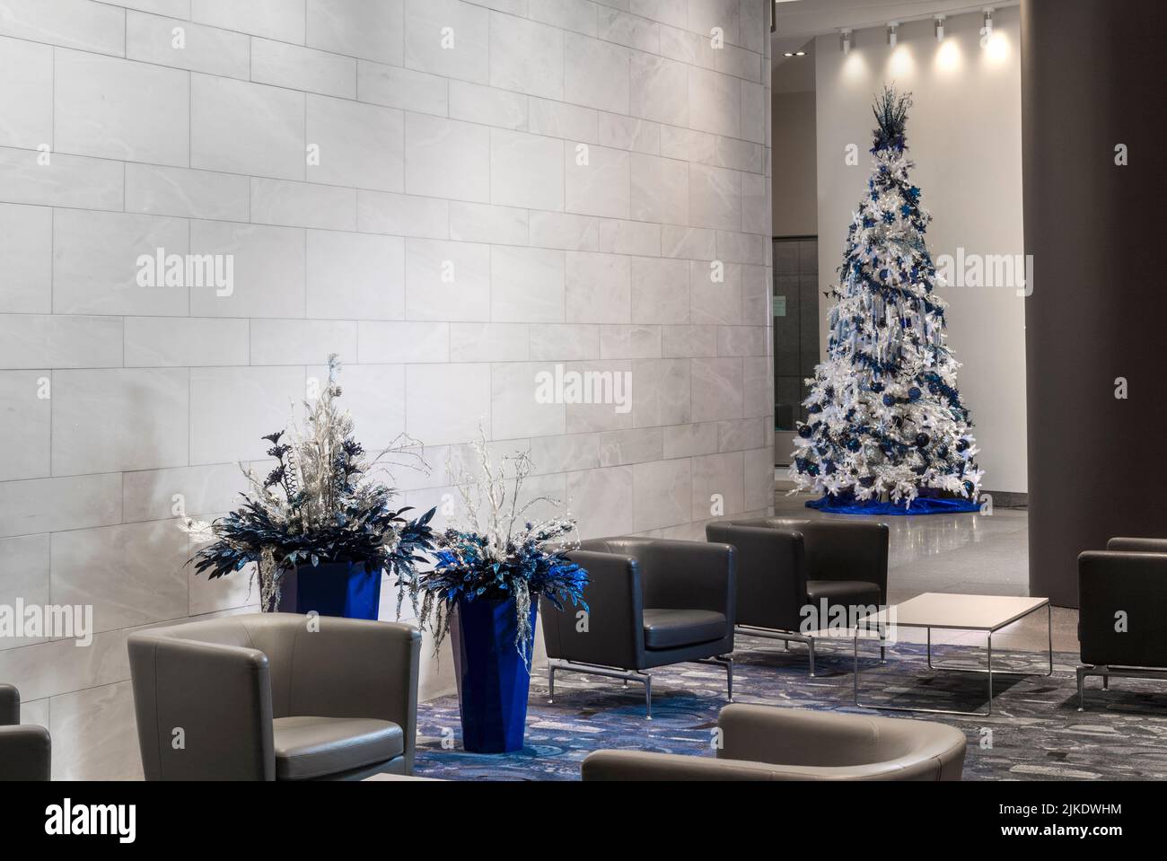 Commercial building modern office lobby decorated for Christmas with Christmas tree, Philadelphia Pennsylvania USA Stock Photo