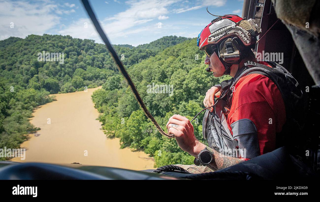 July 30, 202, Hazard, Kentucky, USA: An Airman from the Kentucky Air National Guard's 123rd Special Tactics Squadron search for flood victims from a helicopter in Eastern Kentucky. In response to devastating flooding, the unit coordinated 29 rotary-wing relief missions, rescued 19 people and two dogs, and recovered four bodies. Their command-and-control efforts also facilitated the assistance or recovery of 40 people. (Credit Image: © Staff Sgt. Clayton Wear/U.S. Air National Guard via ZUMA Press Wire Service) Stock Photo