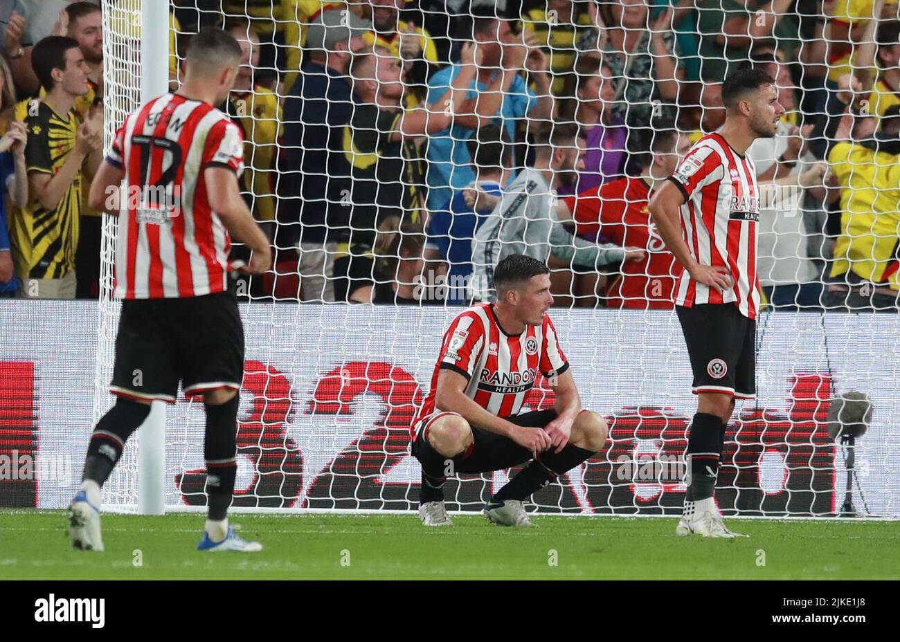 Watford, UK. 1st Aug, 2022. Ciaran Clark of Sheffield Utd and George  Baldock of Sheffield Utd look dejected after their team concede the first  goal of the game during the Sky Bet