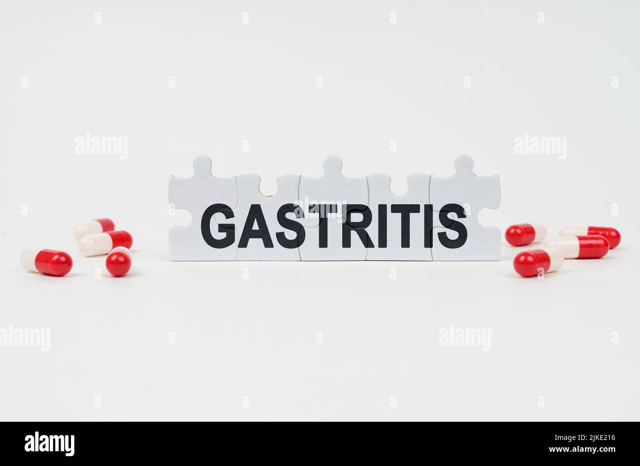 Medical concept. On a white surface are tablets and puzzles with the