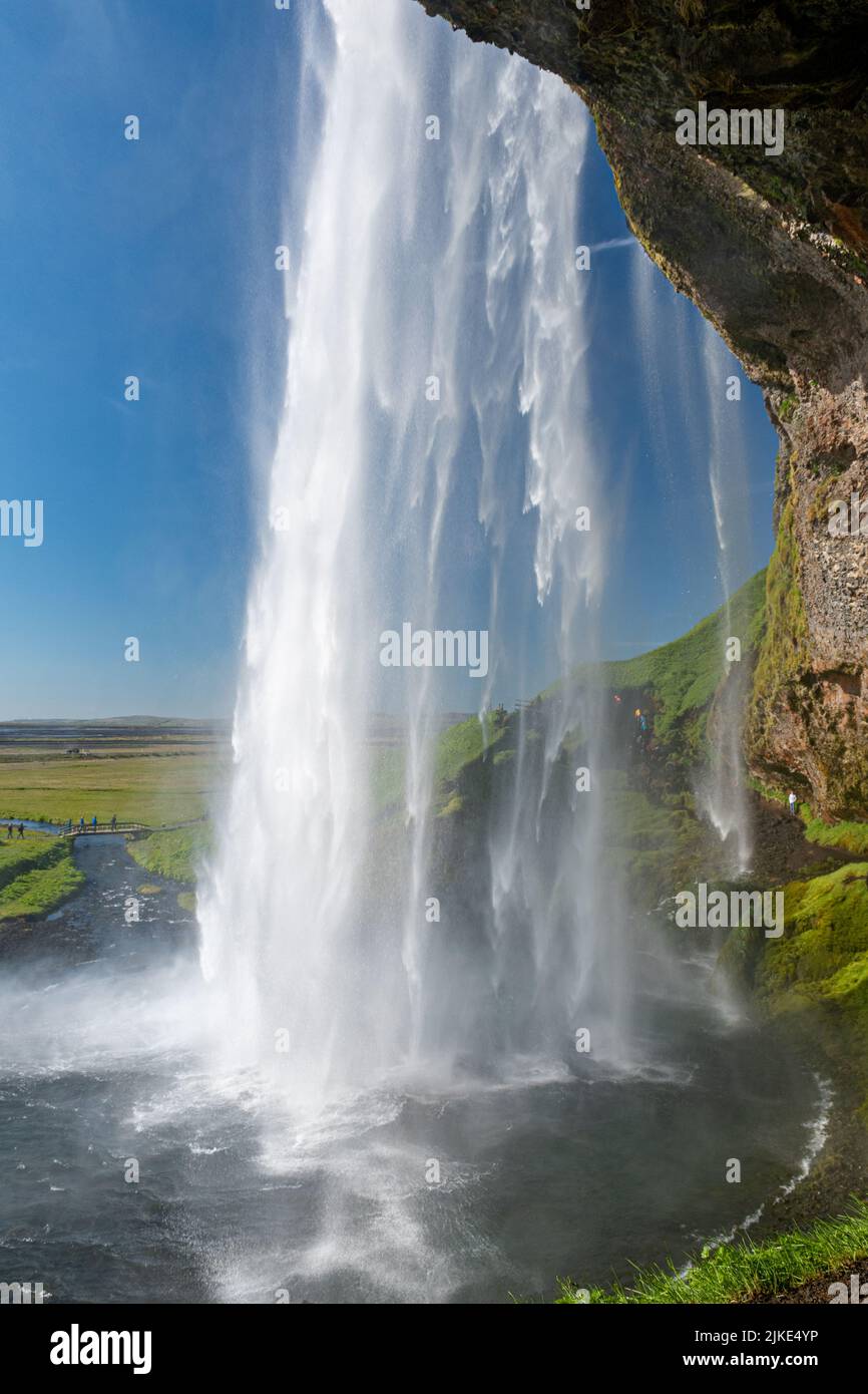 The waterfall Seljalandsfoss in southern Iceland seen from behind Stock Photo