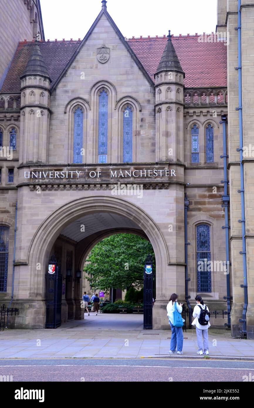 People walk in front of Whitworth Hall, University of Manchester, Oxford Road, Manchester, England, United Kingdom, British Isles. The UK Government has stopped the University of Manchester from licensing vision sensing technology to a Chinese company, citing national security grounds. The UK Government believes there is “potential” for this technology to be used for military purposes and can use the National Security and Investment Act 2021 to halt the agreement. The University of Manchester had made an agreement with Beijing Infinite Vision Technology Company Ltd. Stock Photo
