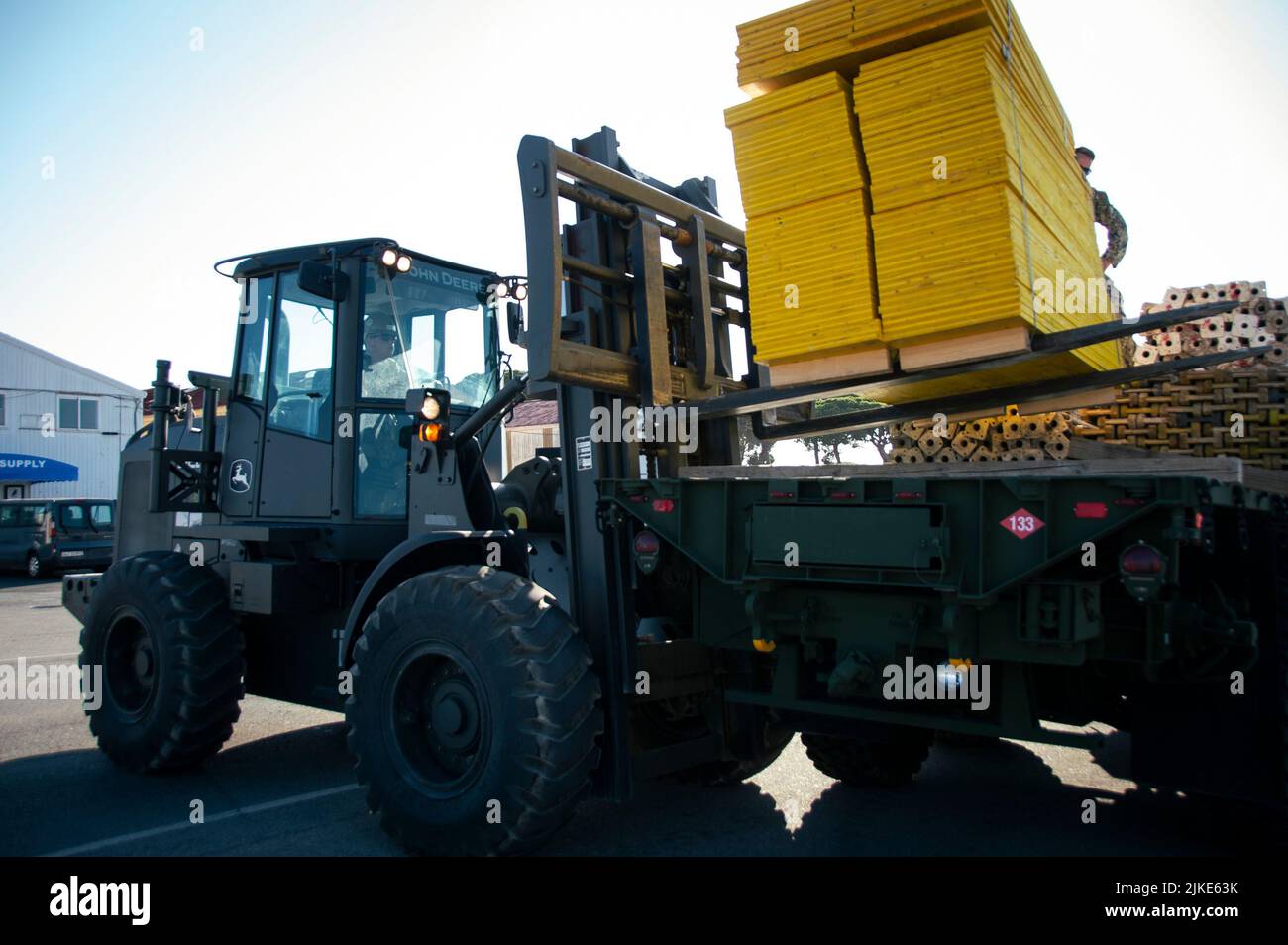 220801-N-PI330-1010 NAVAL STATION ROTA, Spain (August 1, 2022) Equipment Operator 3rd Class Trenton Burnett, assigned to Naval Mobile Construction Battalion 133 (NMCB 133), operates a front-end loader on Naval Station Rota, Spain, August 1, 2022. NMCB 133 is on a scheduled deployment in the U.S. Naval Forces Europe area of operations, employed by U.S. Sixth Fleet to defend U.S., allied, and partner interests. (U.S. Navy photo by Mass Communication Specialist 2nd Class Andrew Waters/Released) Stock Photo