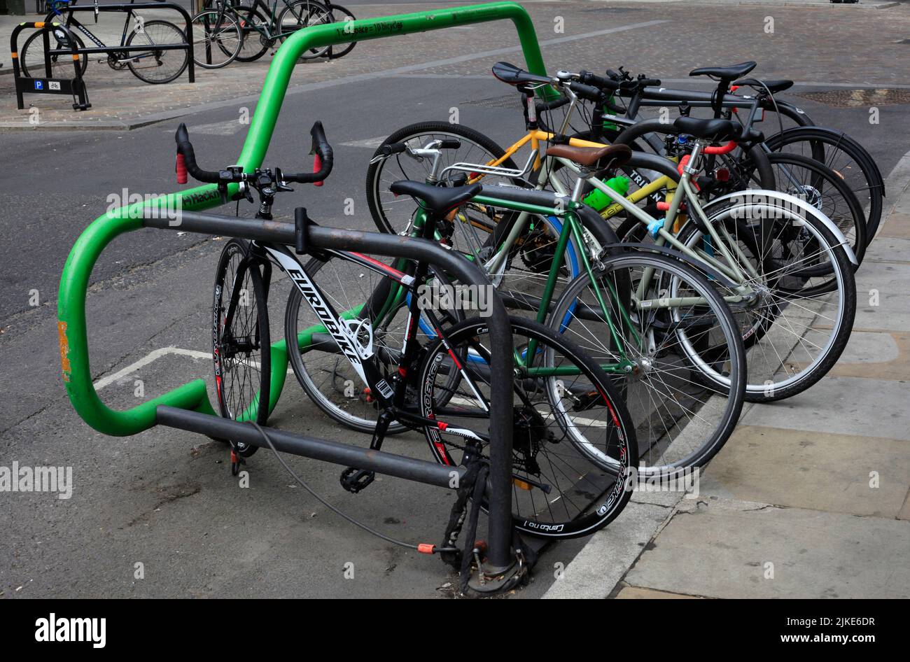 One car equals ten bikes parking space Hackney London Stock Photo
