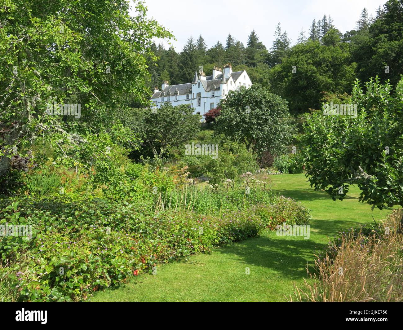 Logie House, a white harled family home in the Scots Baronial style, was originally built in the 17th century, bought in 1924 by Sir Alexander Grant. Stock Photo