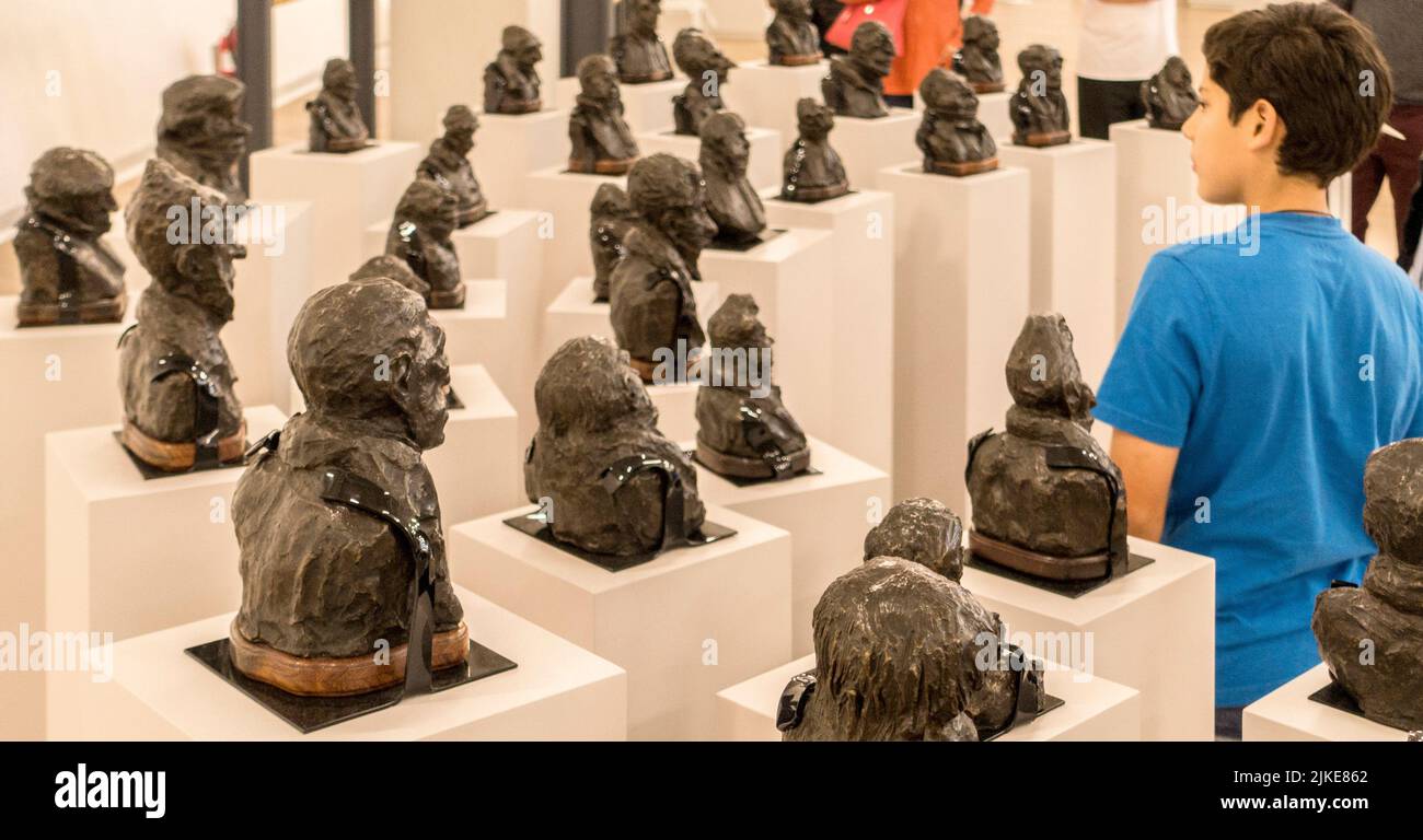 A boy looks at statues by French sculptor Auguste Rodin in the Soumaya Museum, Polanco, Mexico City. Mexico Stock Photo