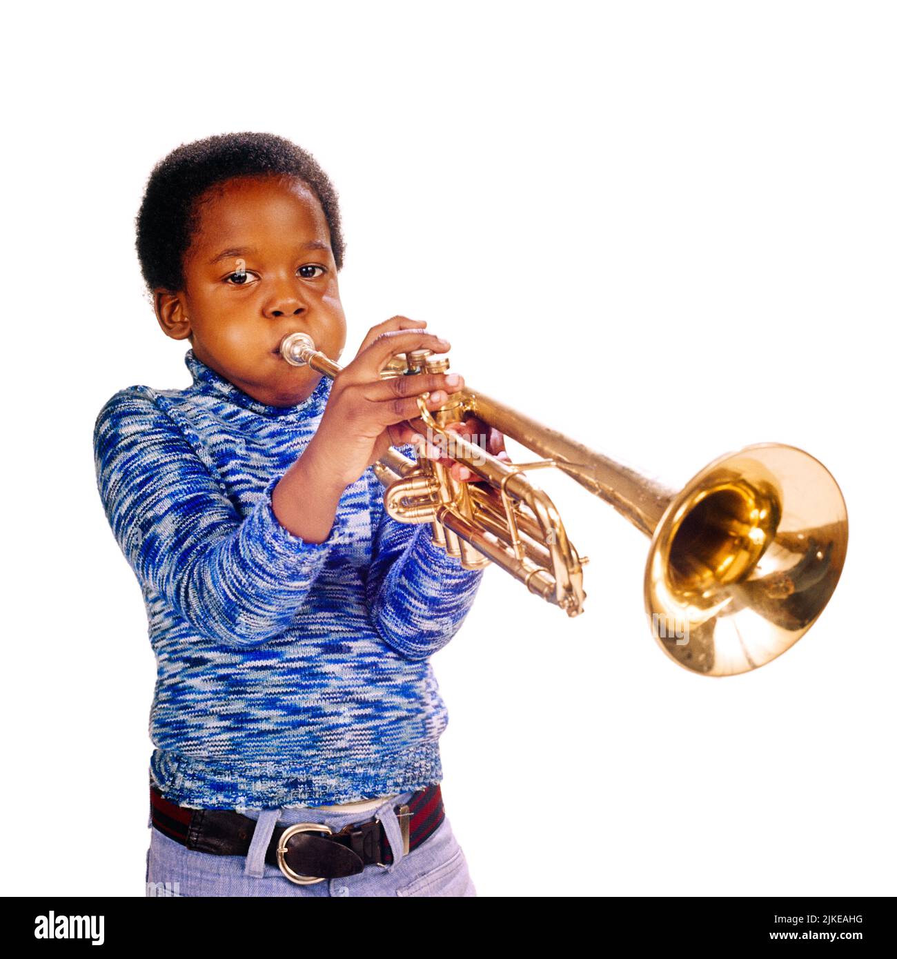 Portrait of young girl playing the trumpet Stock Photo - Alamy