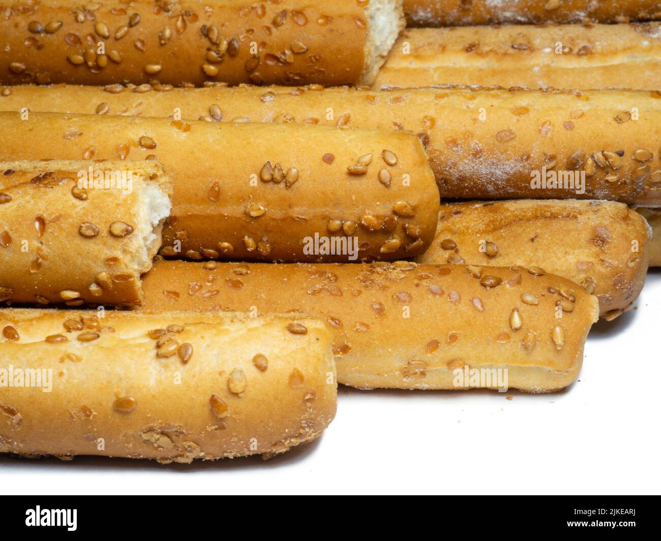 Sesame biscuits on a white background. Biscuits are elongated in the