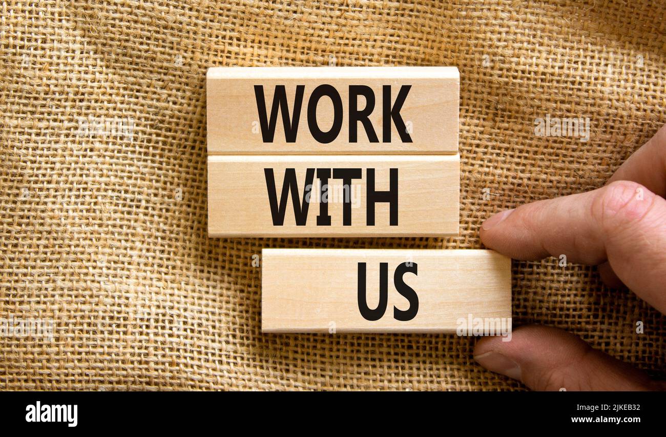 Work with us symbol. Concept words Work with us on wooden blocks on a ...