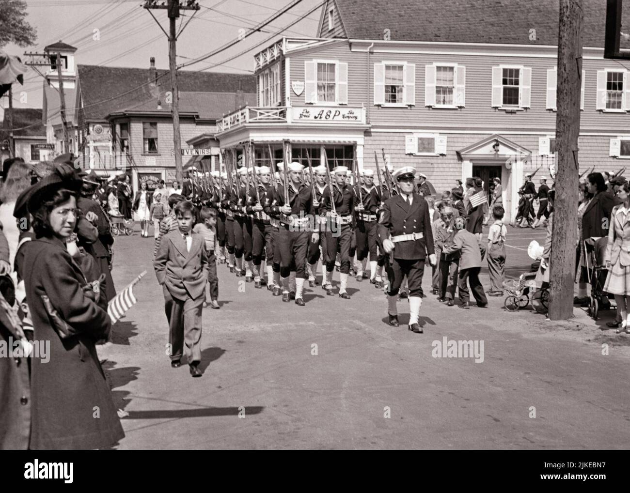 1940s 1950s FORMATION OF UNITED STATES COAST GUARD MEN ON PARADE IN PROVINCETOWN CAPE COD MASSACHUSETTS USA - q75040 CPC001 HARS OLD FASHIONED Stock Photo