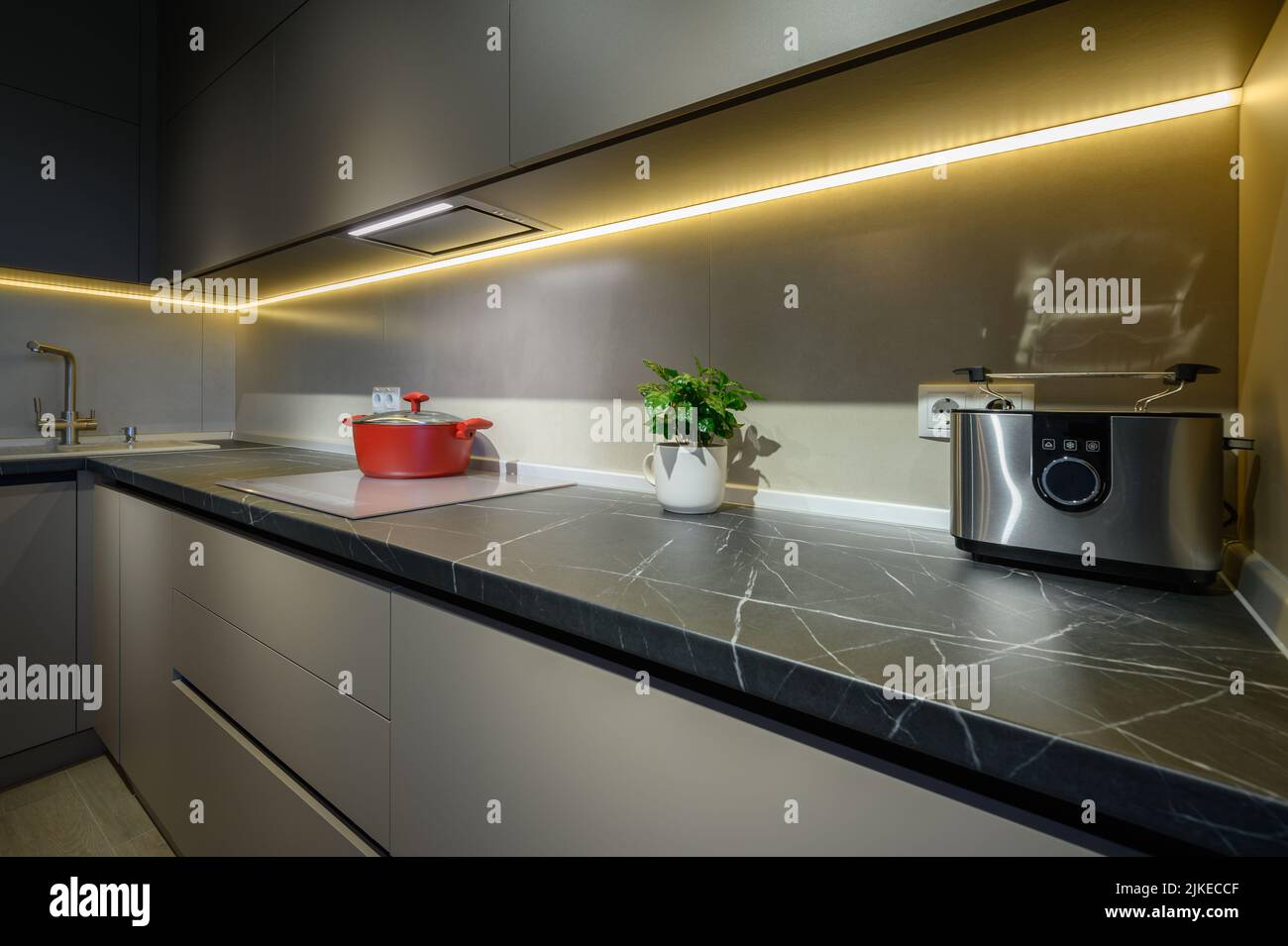 Modern grey luxurious kitchen furniture, closeup to worktop Stock Photo