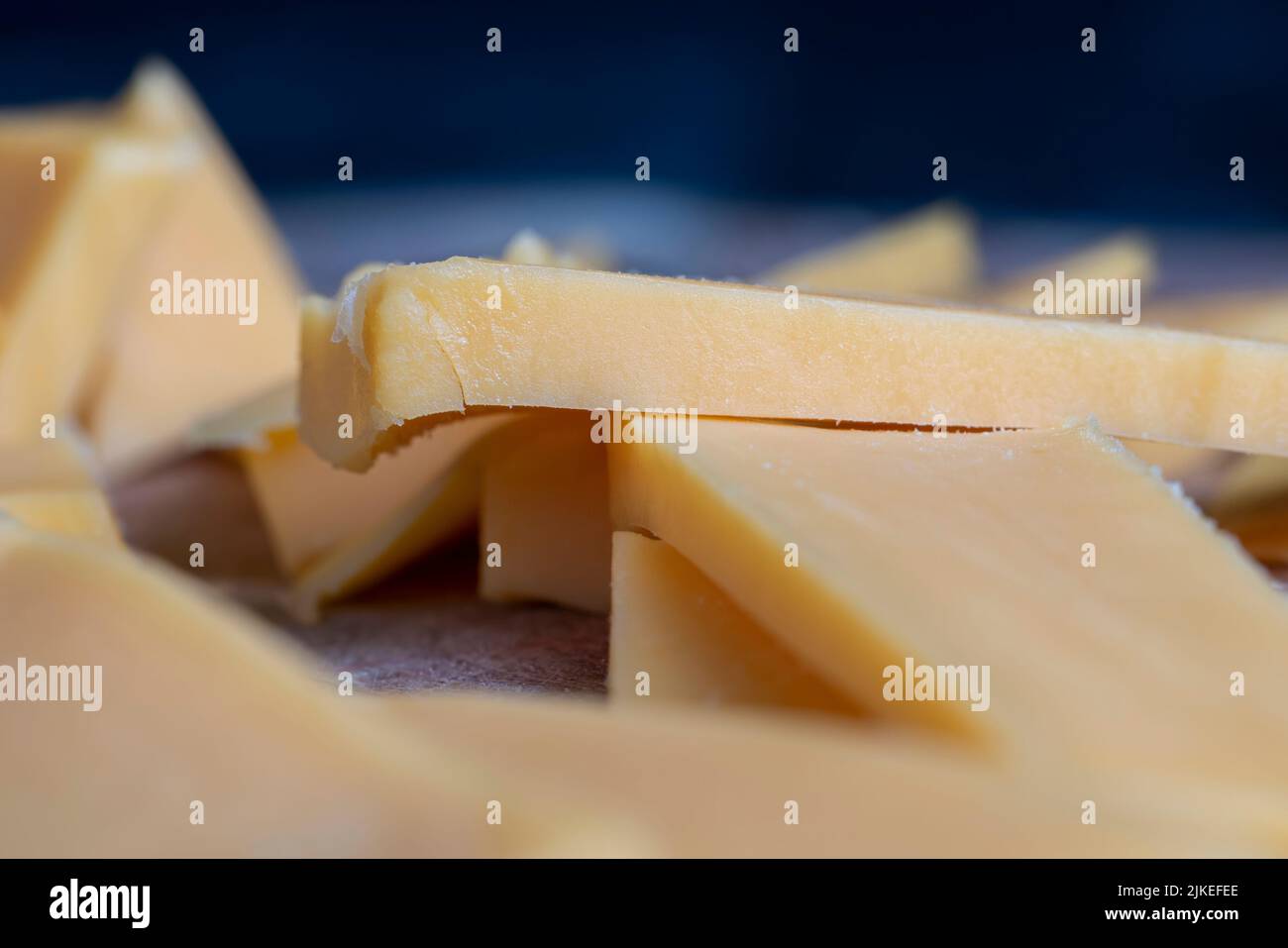 Sliced yellow cheese made from cow's milk, solid quality yellow cheese