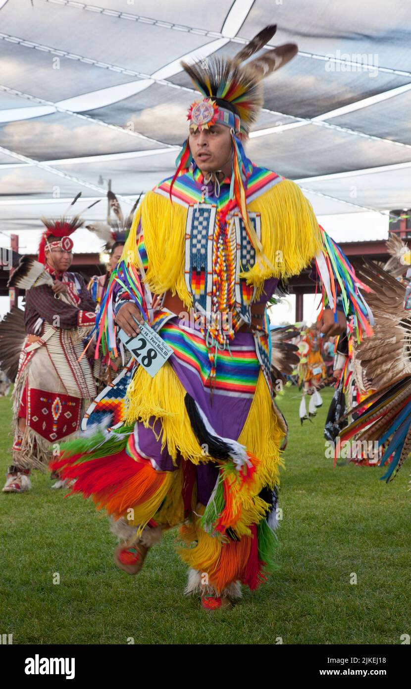 Adult man dressed in colorful grass dancer outfit at the Shoshone