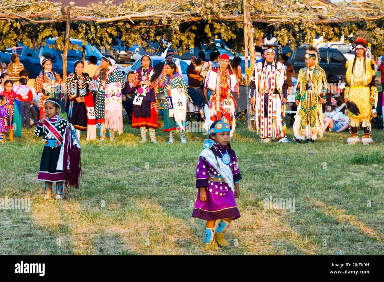 Line up under the arbor around the pow wow arena before they dance