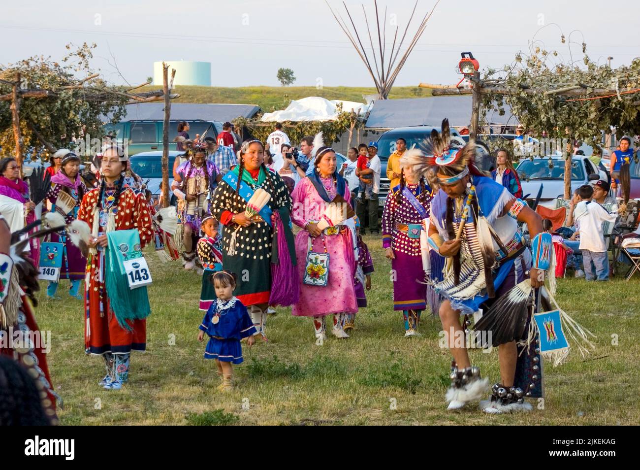 Line up under the arbor around the pow wow arena before they dance