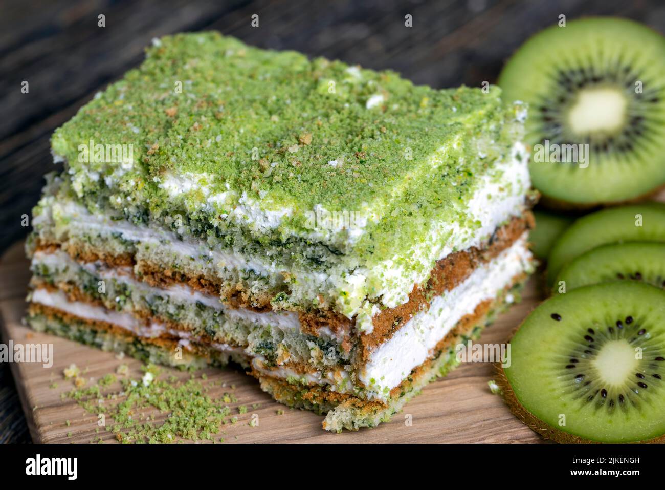 a piece of green cake with creamy filling, fresh and sweet green cake