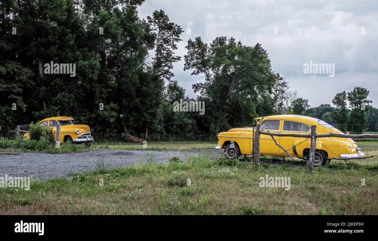 A 49 Chevolet Deluxe 4door cut in half, each on a track which closes a