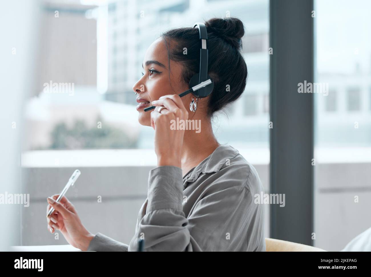 It seems we need to update your information. a young female call center worker. Stock Photo