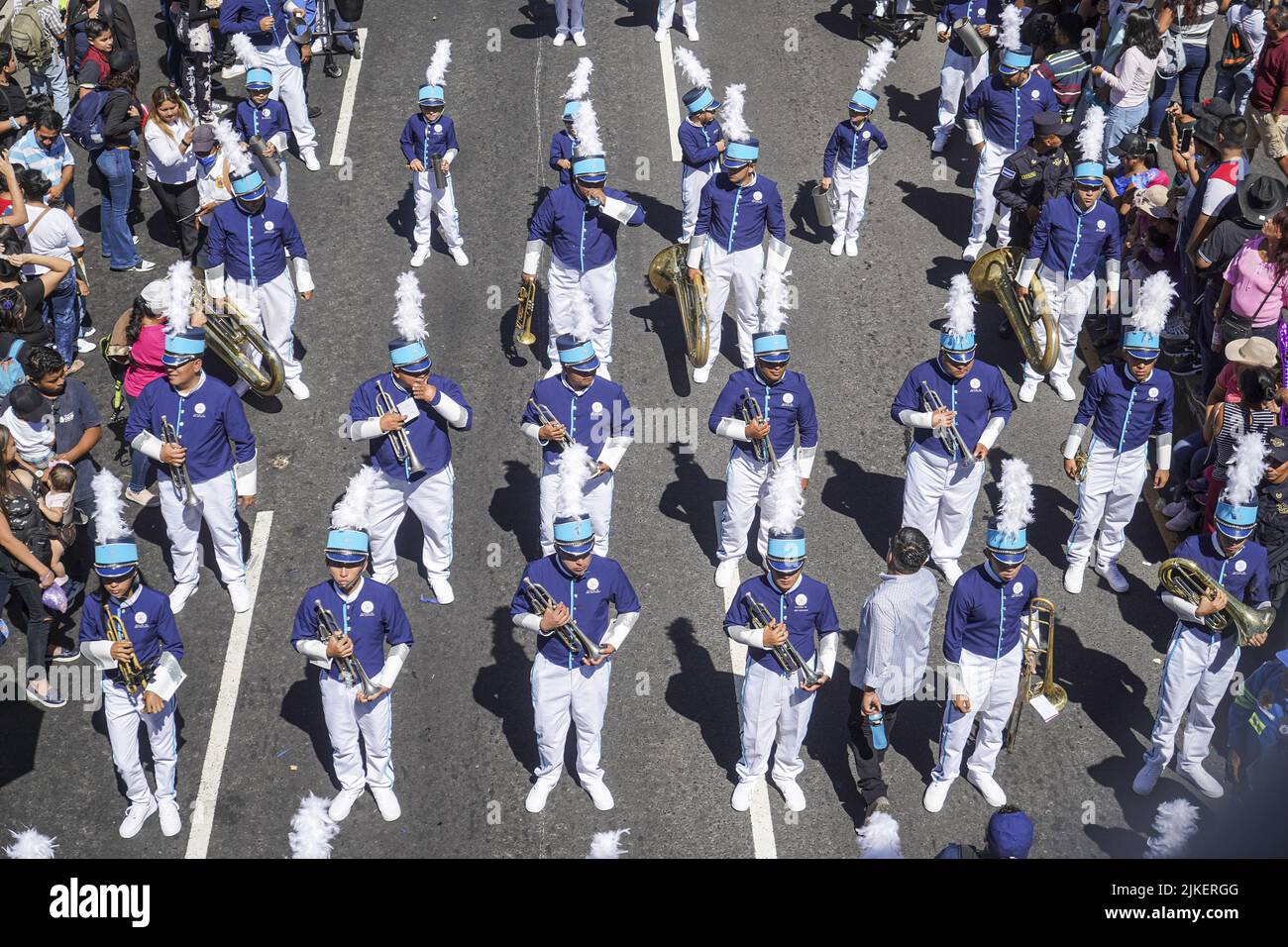 Members of a marching band march during a parade at the beginning of