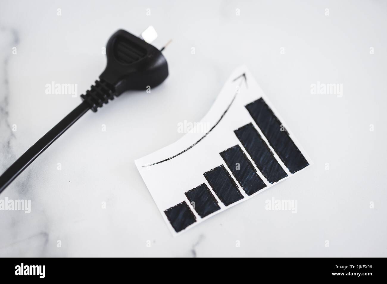 electricity costs going up ,conceptual image with plug nxt to stats