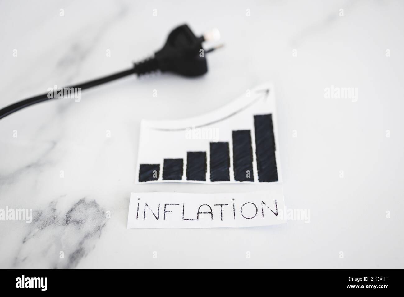 electricity costs going up ,conceptual image with plug nxt to stats