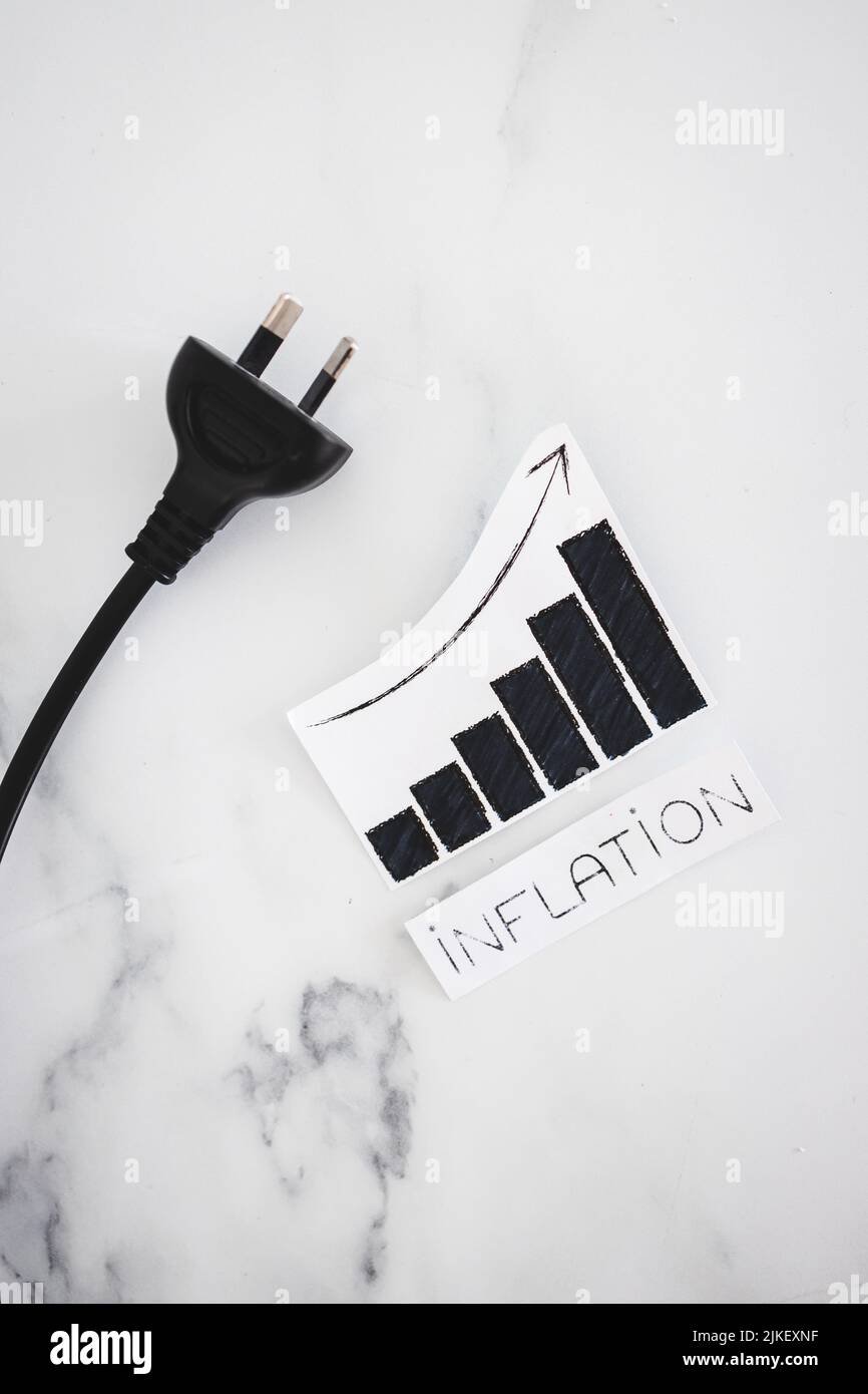 electricity costs going up ,conceptual image with plug nxt to stats