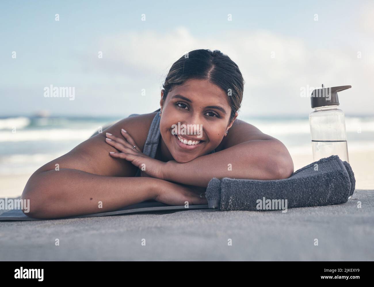 I feel super relaxed after that workout. a sporty young woman lying on