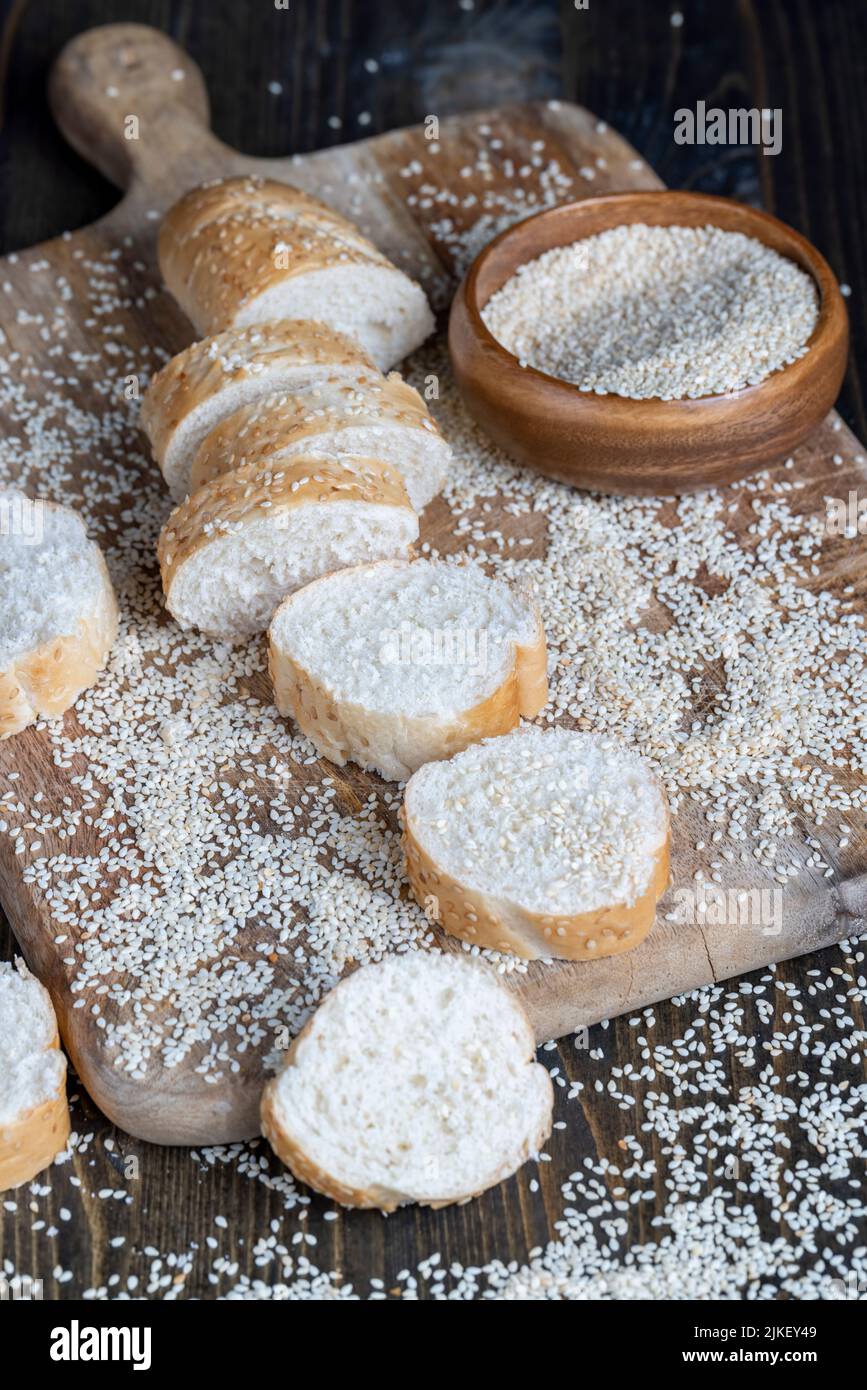 wheat grain baguette sprinkled with sesame seeds, wheat flour baguette ...