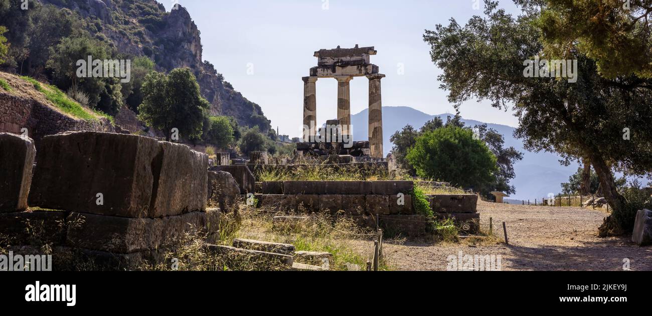 Delphi Greece, Archaeological Site. Ancient Greek considered Delfi as the centre of the world. Temple stone and columns ruins Stock Photo
