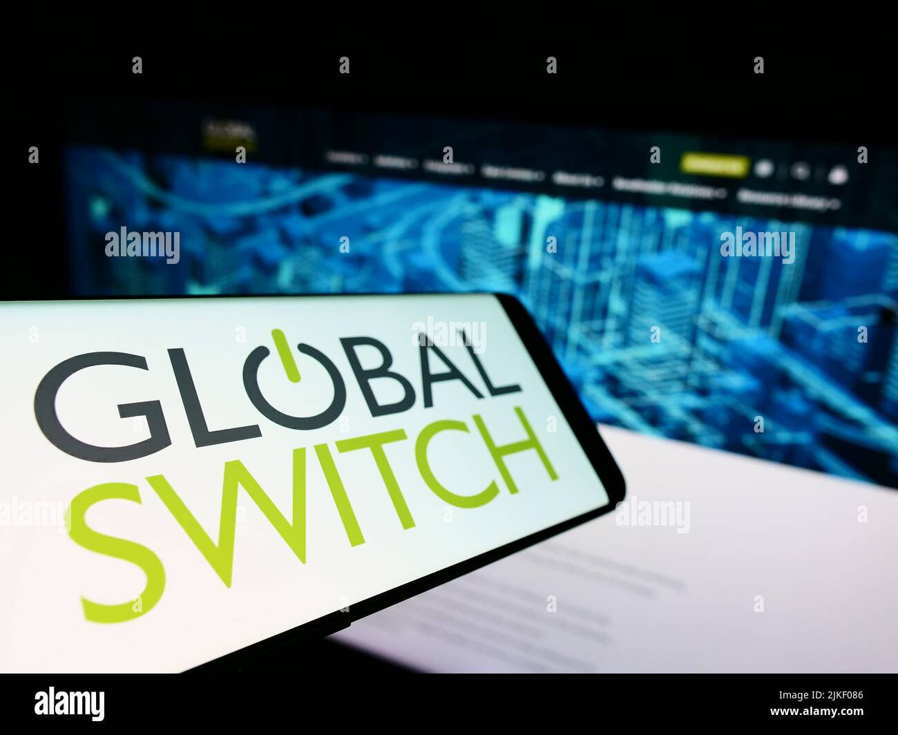 Cellphone with logo of British data center company Global Switch Limited on screen in front of business website. Focus on left of phone display. Stock Photo