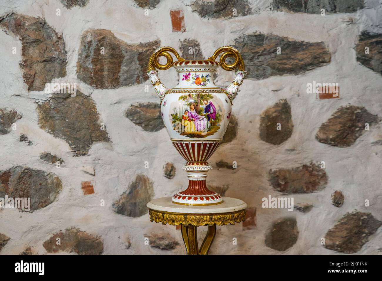 Antique old vase with painting on a stone background Stock Photo