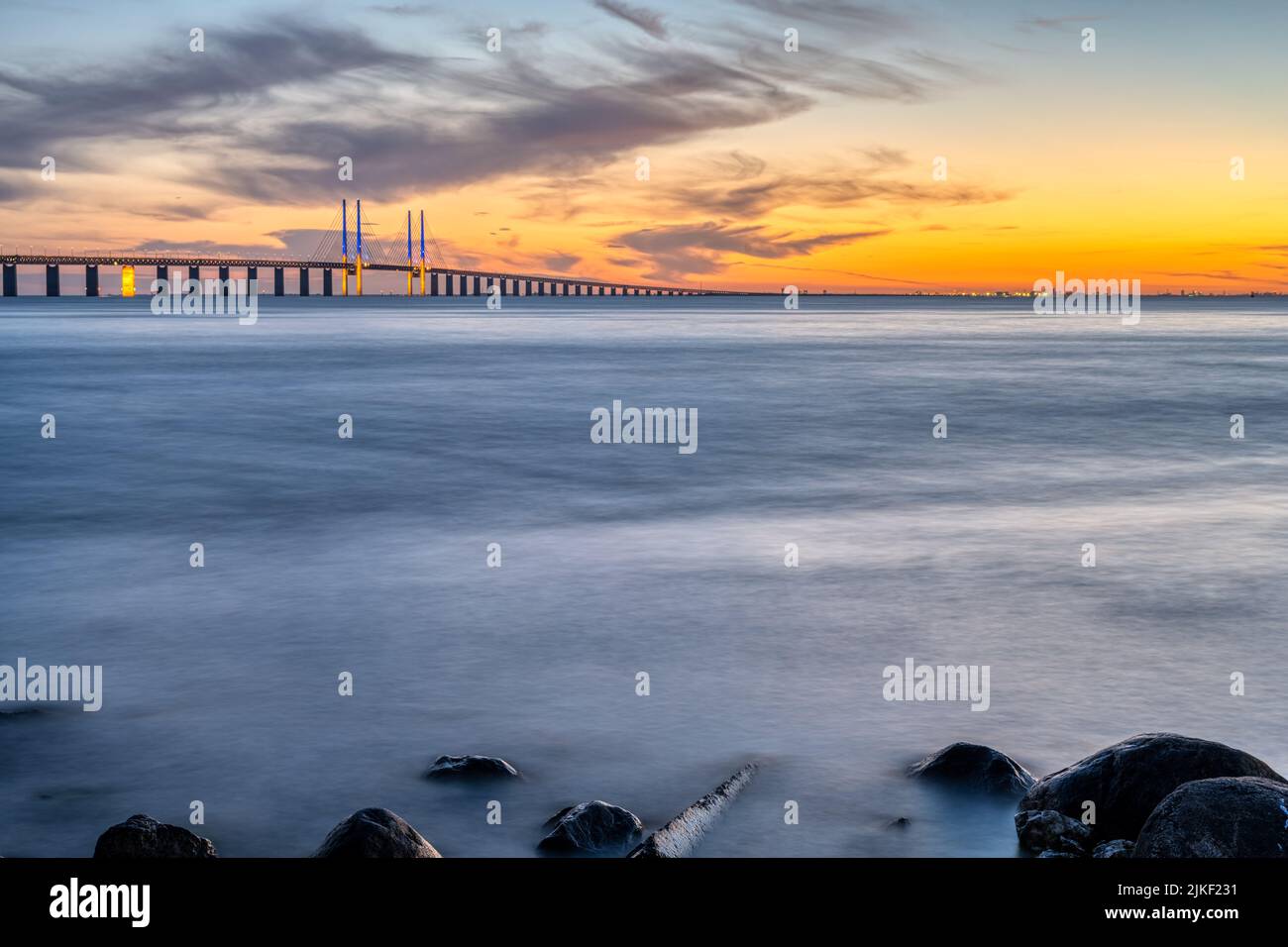 The Oresund between Denmark and Sweden with the famous brigde after sunset Stock Photo